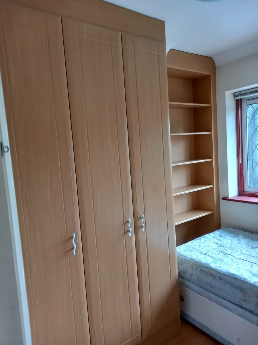 Bedroom wardrobe and shelving dusted and wiped down
