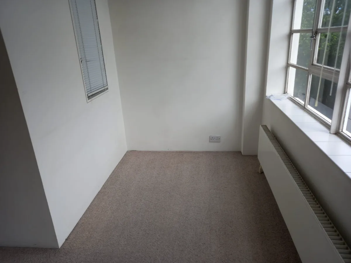 Empty room with carpets vacuumed and sills wiped for a move-out