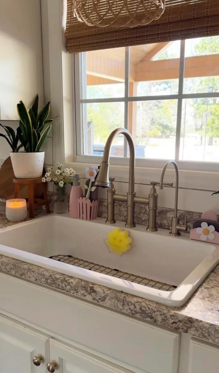 Farmhouse kitchen sink and counters cleaned and shining
